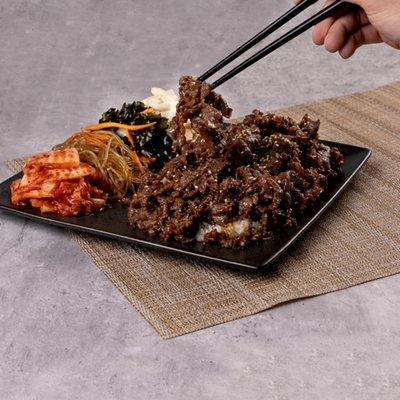 Marinated thin slices of beef basted with house sauce with your choice of banchan (side dishes)