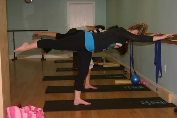 Barre class, fold over exercise.