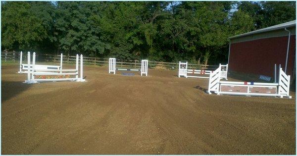 Recently renovated outdoor arena that drains extremely well - Full set of PVC jumps!