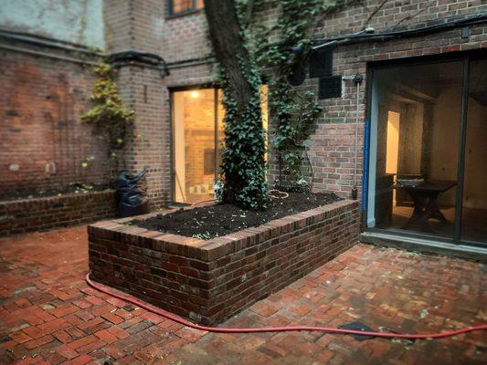 Reclaimed brick used for a new garden bed/seating wall.