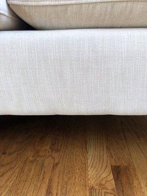 The bottom of the sofas was bumpy and uneven. The faint stripe in the fabric wasn't straight.