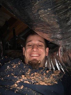 Johnny working in an attic.