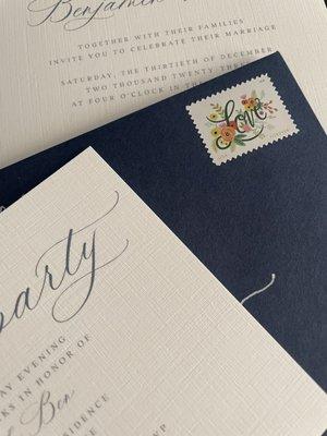 Close-up of the pretty linen paper invitations