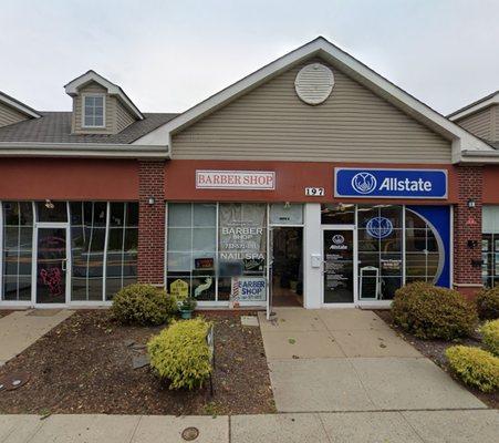 Barber shop is located next to Allstate.