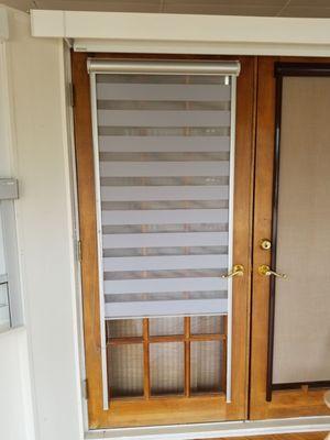 Shade that moves to be solid or have opaque stripes - adhesive used instead of fasteners, for hurricane glass doors!