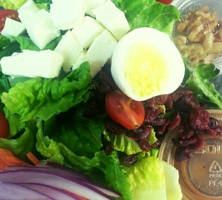 Nutty salad with honey vinaigrette Sift mozzarella,  almond,  walnut and more healthy stuff on fresh romaine