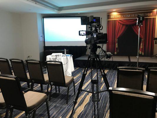 Shooting a client's speaking portion at a conference.