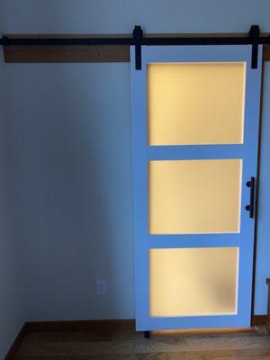 Sliding barn door added more space inside the new bathroom.