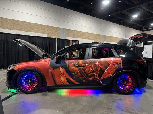 Heise Chasing RGB Lighting installed in this Superman themed Mazda