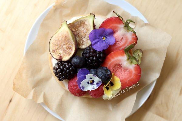 Individual Fruit Tart ($6) - with vanilla pastry cream, fresh fruit, and edible flowers