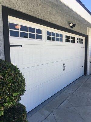 Insulated steel door with decorative hardware.