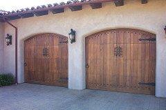 Installation OfCarriage style wood garage door in Newton. By RD Garage Door Repair.