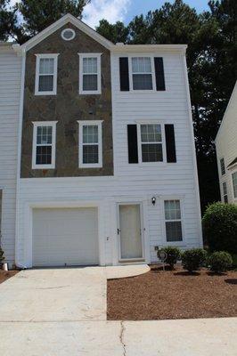 Home exterior makeover, new window wood trimming, door frame, window rain guards, shutters, paint, shutters and lighting.
 Lawrenceville, GA