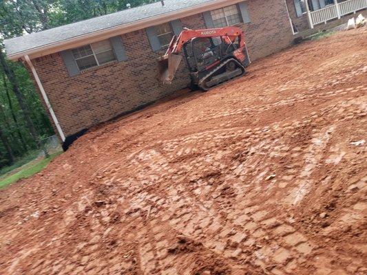 Had to fill beside home 3+ ft to allow proper drainage away from home. Getting ready for the retainer wall design