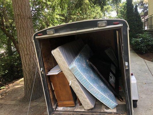 Picture to give a perspective on the size of my trailer. There is more junk towards the front of the trailer. Trailer is 10ft long.