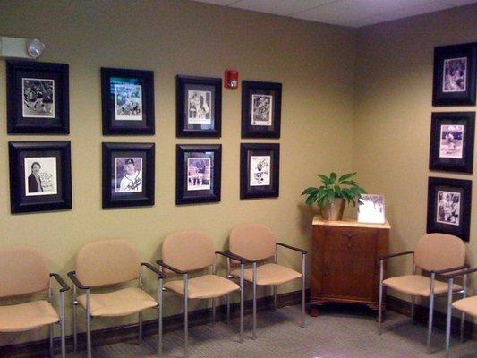 Spacious, comfortable waiting area with signed photographs of previous athletes thankful for Dr. Troy's practice.