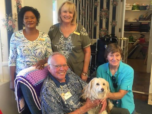 Clients and staff enjoying pet therapy.