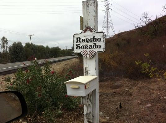 Small sign along side of road