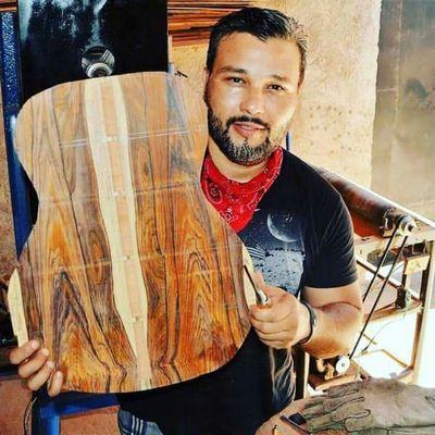 Ivan Jimenez Jerez Luthier /Owner holding the back of #3 of the Cedar Collection