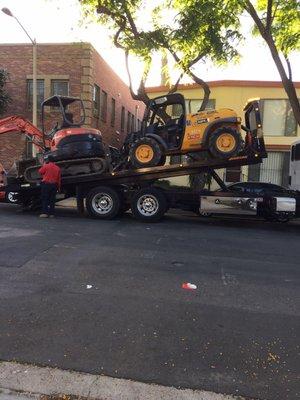 Here is the driver delivering the backhoe before 8am. Which is illegal in West Hollywood. He then proceeded to flip me off.