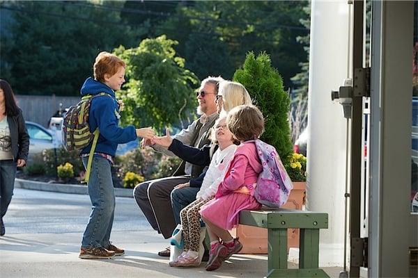 Students are greeted with a smile and a handshake every day.