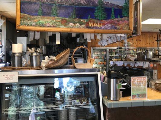 Food counter or kitchen or little restaurant at the back of the grocery store. Closes on Sat and Sundays.