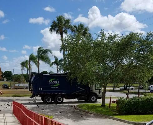 Here is the truck stopped in our driveway with trash all over the place