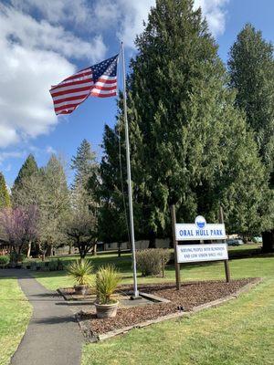 Main entry with American flag and Oral Hull sign