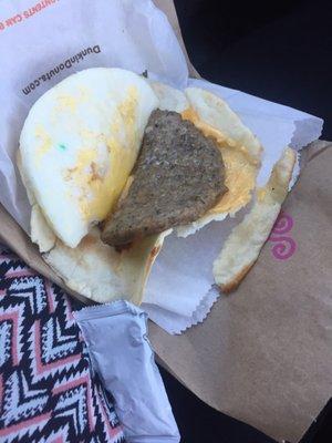 Disgusting sandwich. Burned cheese ruined wrap green thing on the egg ????? Wtf