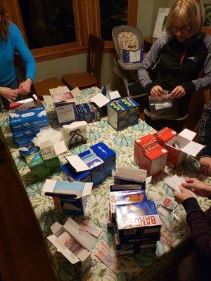 Making first aid kits for distribution to local NGOs