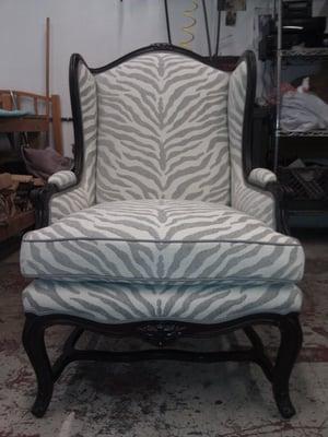 Refinished and reupholstered win back chair.