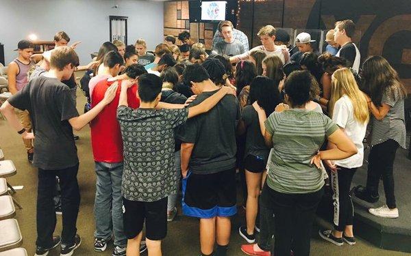 Praying for their Youth Pastor