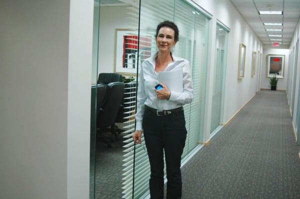 Cynthia Braden in hall outside conference room