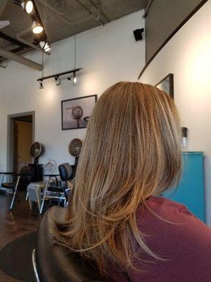 Work by Mitch at Modify Hair Lounge: A classic layered look complements this blonde partial highlight.