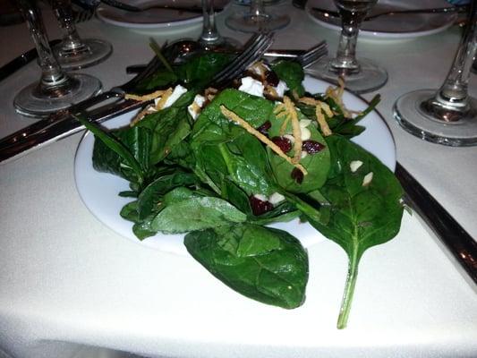 Salad with a light vinaigrette, goat cheese and dried cranberries.