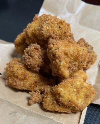 Seasoned nugs ready to be tossed in one of our 6 house-made sauces and sprinkled with one of our 6 dry spice mixes