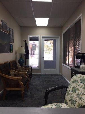 Office lobby! A cozy space to await your appointment. Water and warm beverage station for you.