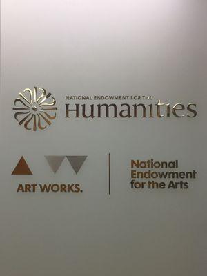 Logos of the National Endowment for the Humanities and National Endowment for the Arts in the lobby.