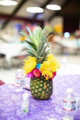 Pineapple and flower centerpieces.