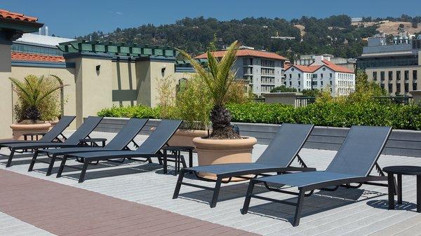 Social rooftop lounge with views of the city and Berkeley hills.