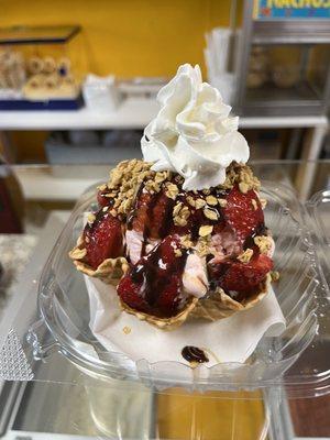 Angel ice cream with strawberries, whipped cream and chocolate sauce