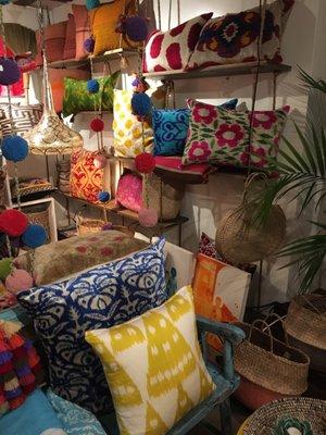 A wall of brightly colored pillows!