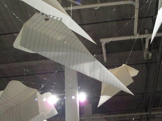 Giant notebook paper airplanes.