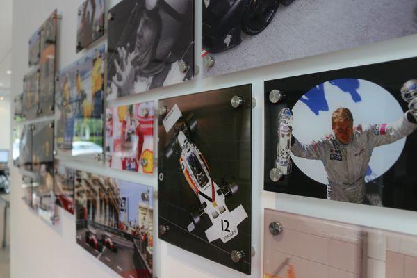 McLaren racing heritage wall located in the McLaren Palm Beach showroom.