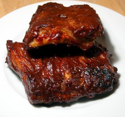 Slowed smoked ribs with our Rub and BBQ Sauce