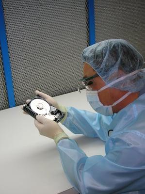 Examining a Hard drive in the Clean Room.