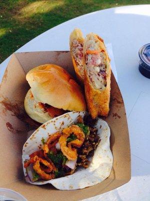 Redneck egg roll, pulled pork slider, and brisket Taco