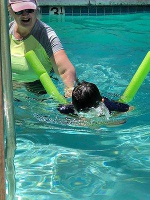 Learning to dog paddle with front breathing.