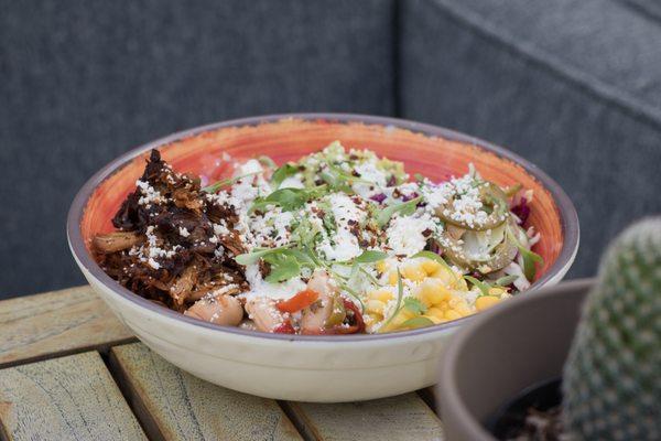 Bahía Burrito Bowls, gigante beans, vegetable salpicon, arroz verde, queso, corn, crema picante, guacamole