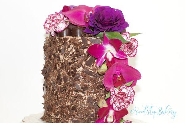 Signature Chocolate Cake filled with Chocolate Italian Meringue Buttercream and Coated with Columbian Chocolate Shavings